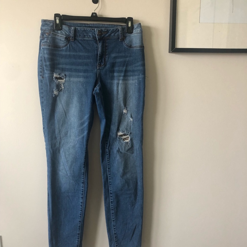 Skinny jeans with camo patches, barely worn.